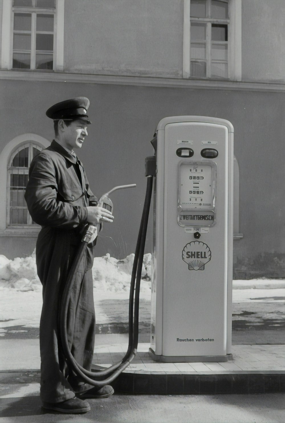 man in black coat holding microphone