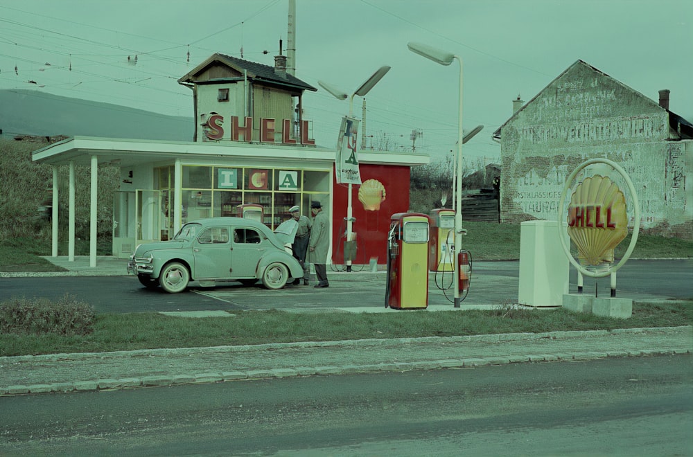 white vintage car on road during daytime