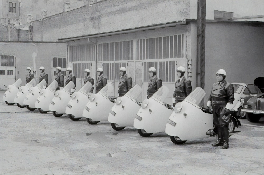 people in white suit sitting on white chair