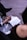 A close-up of a therapist's hands holding a notepad during a session.