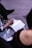 Close-up of a thoughtful person writing notes during a therapy session.