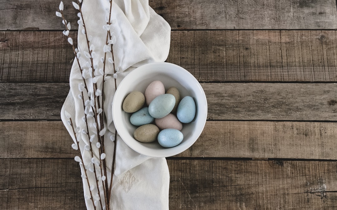 blue and green egg on white ceramic bowl