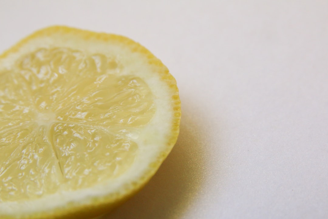 yellow lemon on white surface