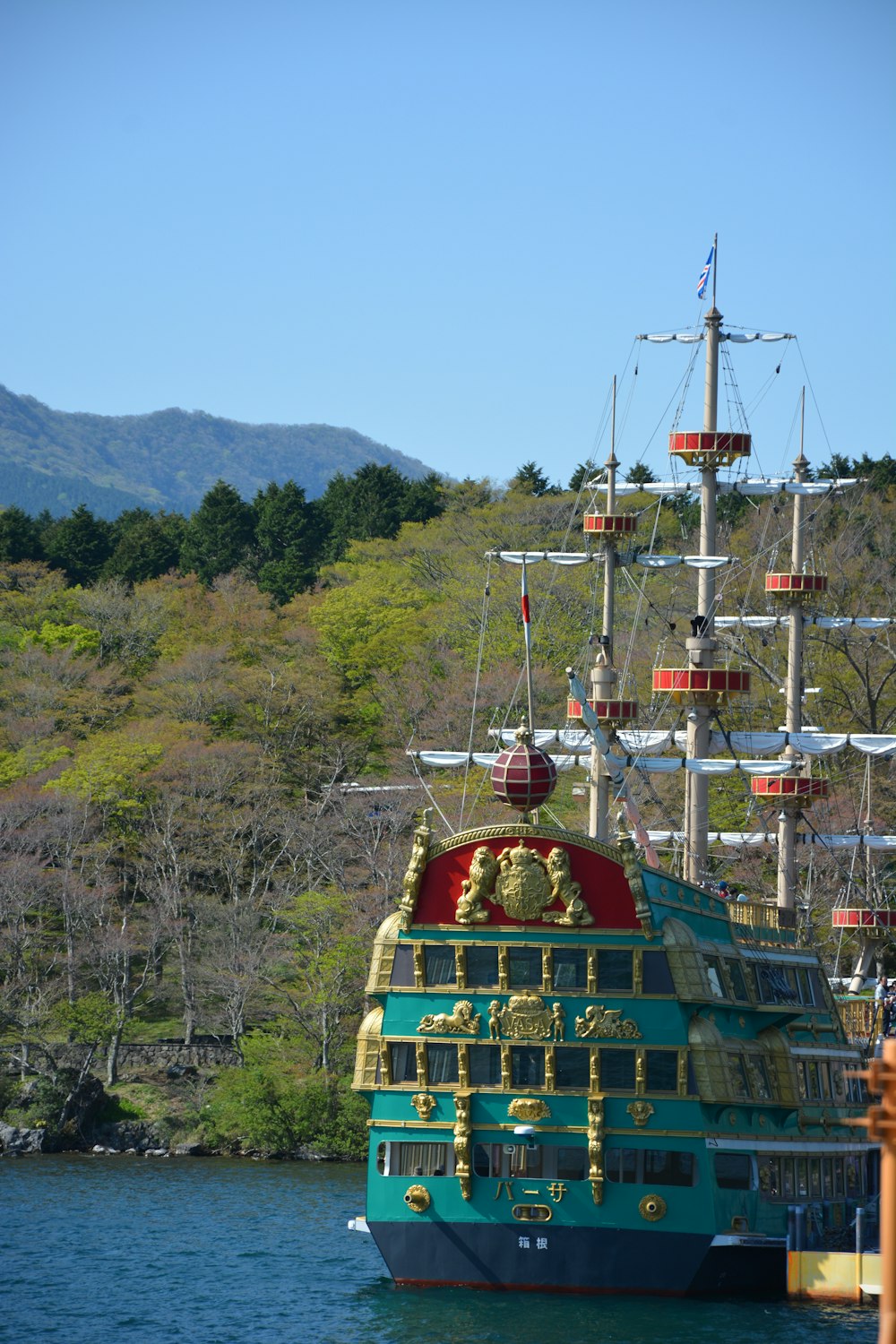 green and brown ship on green grass field during daytime