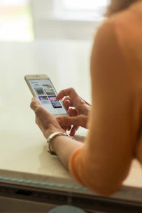 person holding silver iphone 6