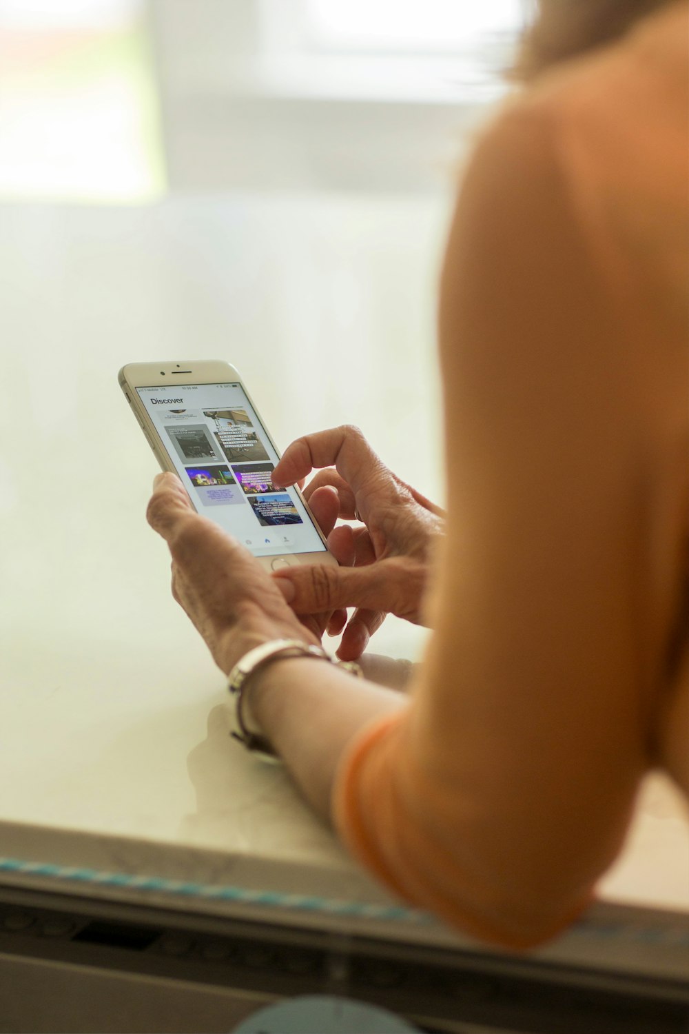 person holding silver iphone 6