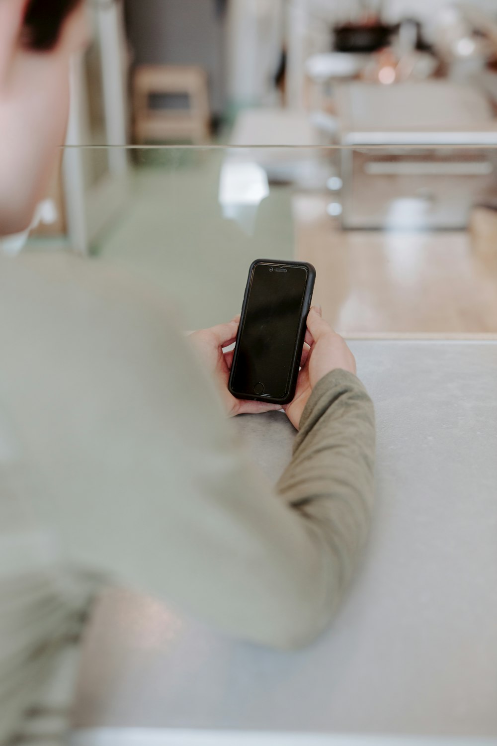 person holding black iphone 5