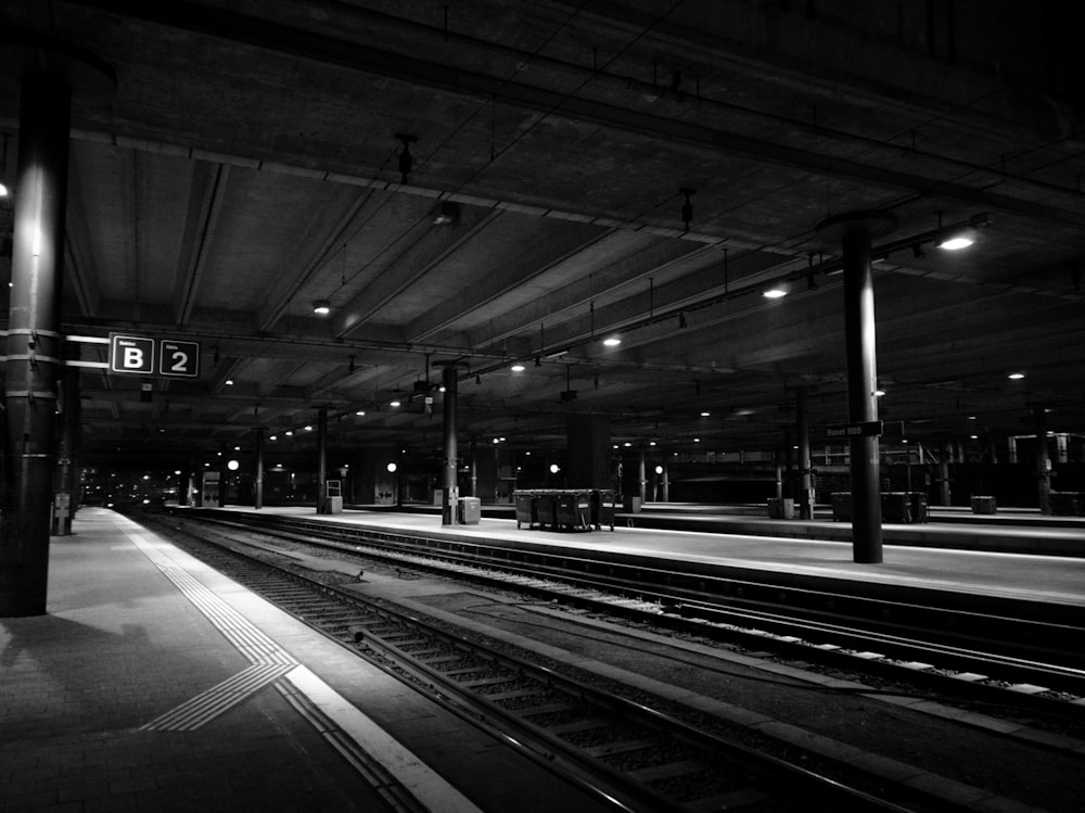 grayscale photo of a train station