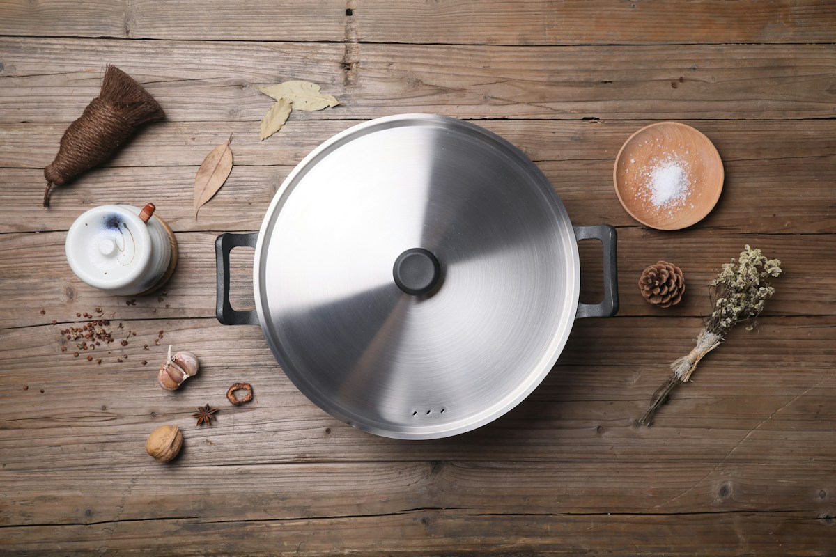 How Do You Safely Remove a Vacuum-Stuck Pot Lid?