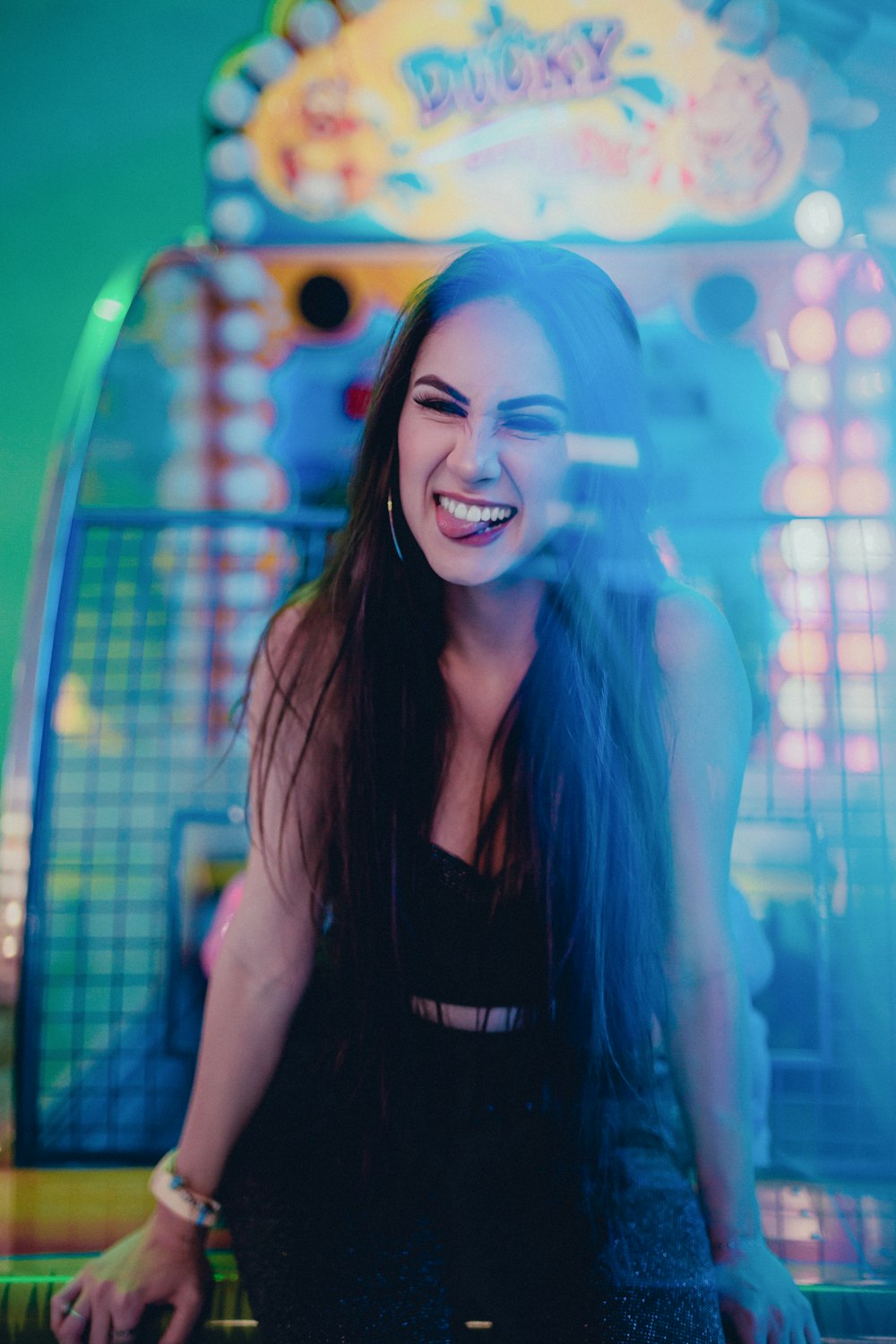 woman in black sleeveless shirt smiling