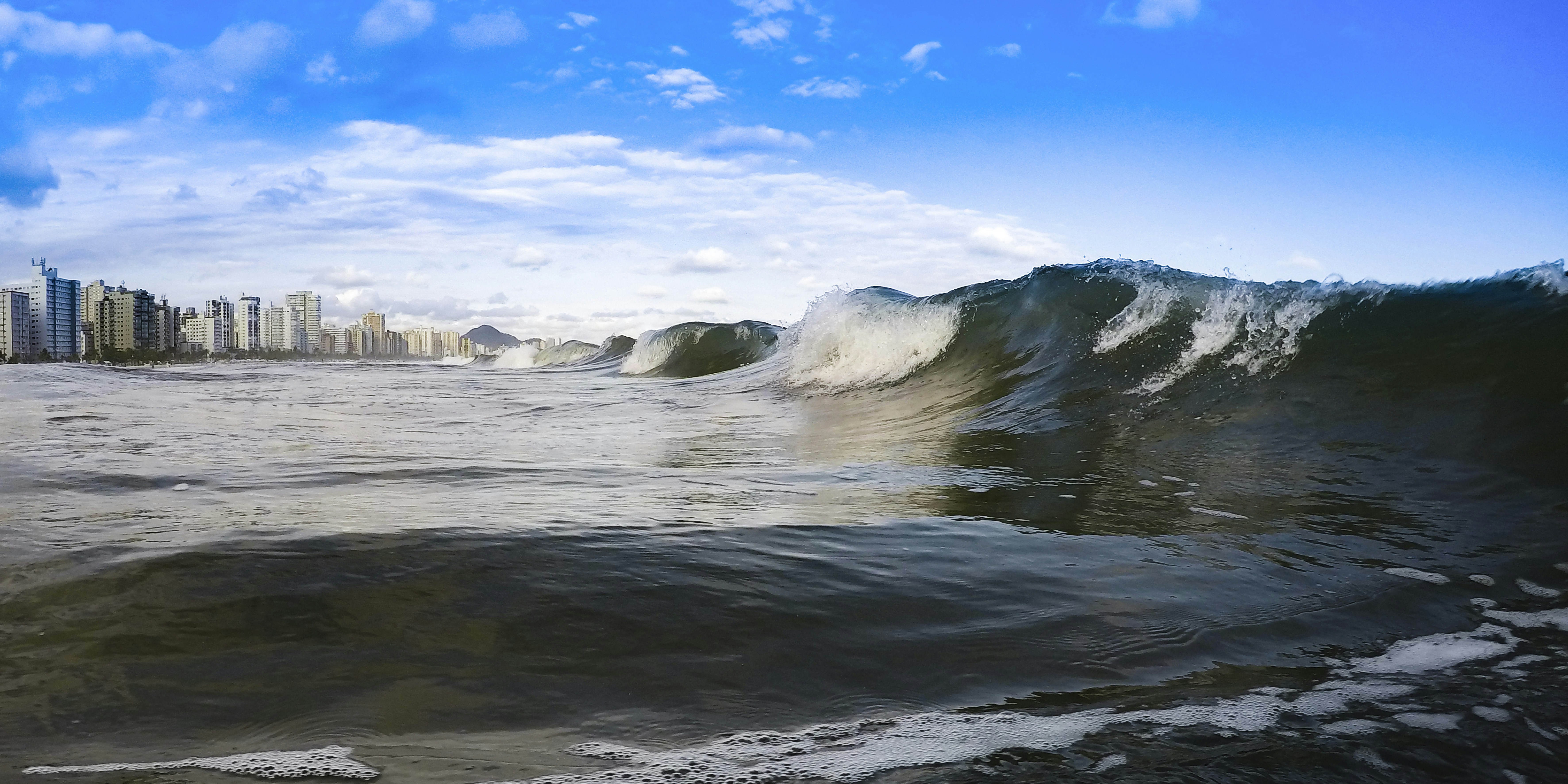 water waves hitting the shore during daytime