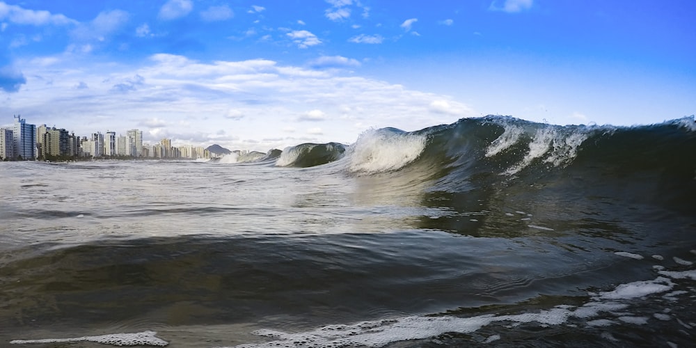 water waves hitting the shore during daytime