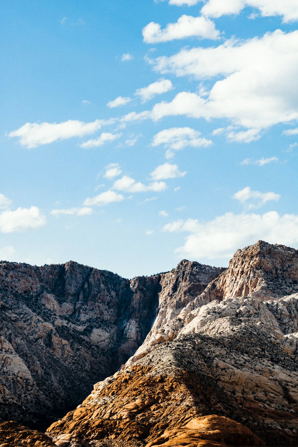 brown rocky mountain under blue sky during daytime