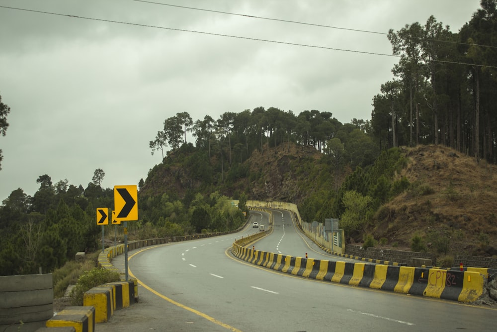 gray concrete road with no cars during daytime