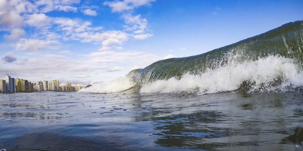 ocean waves crashing on shore during daytime