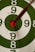 green white and black round with red line