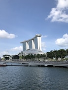 white concrete building near body of water during daytime