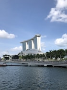 white concrete building near body of water during daytime