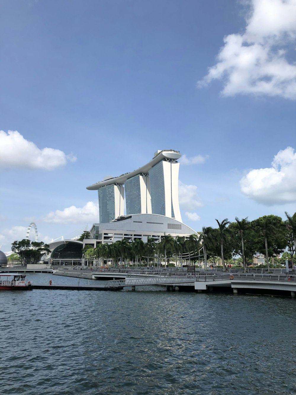 white concrete building near body of water during daytime