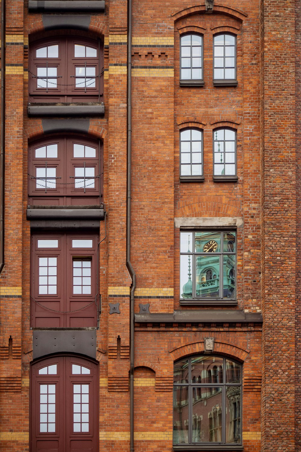 brown brick building with brown wooden window