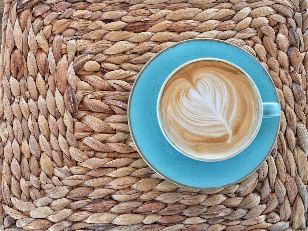 blue and white ceramic mug on blue round plate