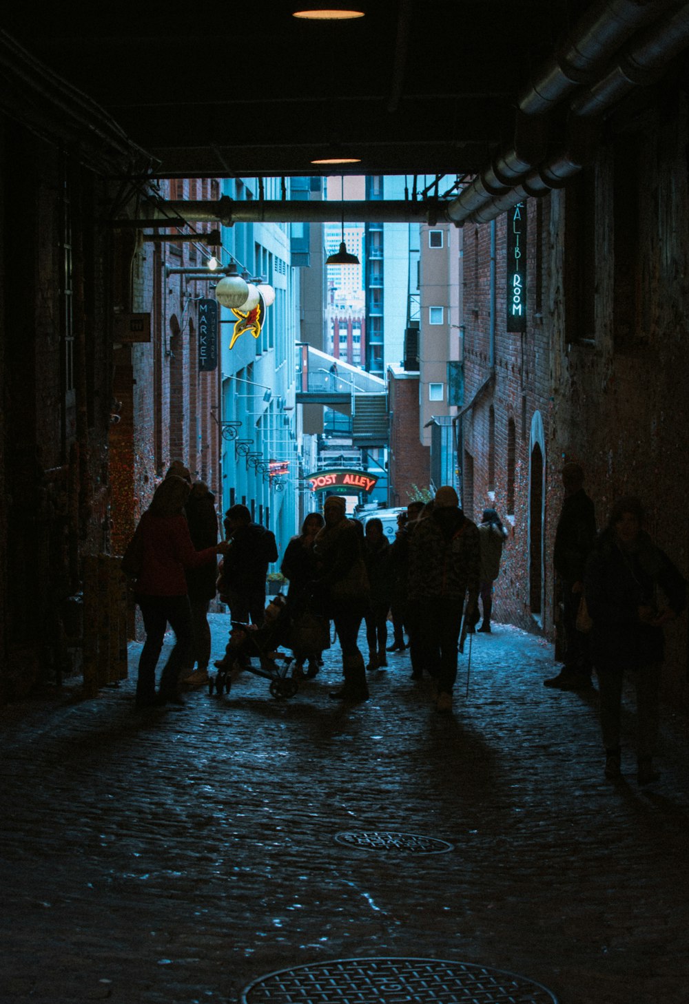 people walking on street during nighttime