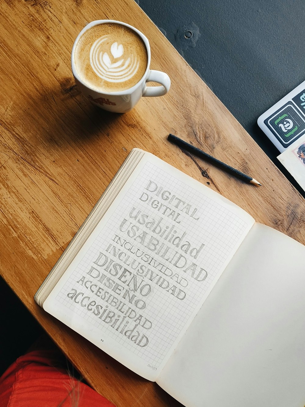 white ceramic mug on brown wooden table