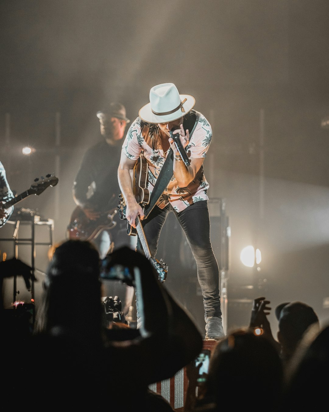 man in cowboy hat playing guitar