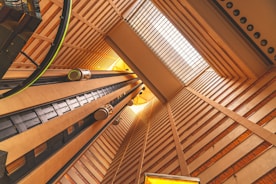 brown wooden ceiling with green and yellow light