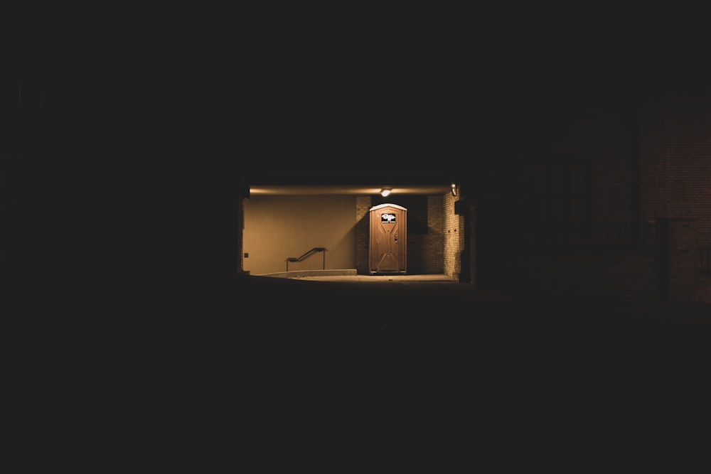 brown cardboard box in dark room