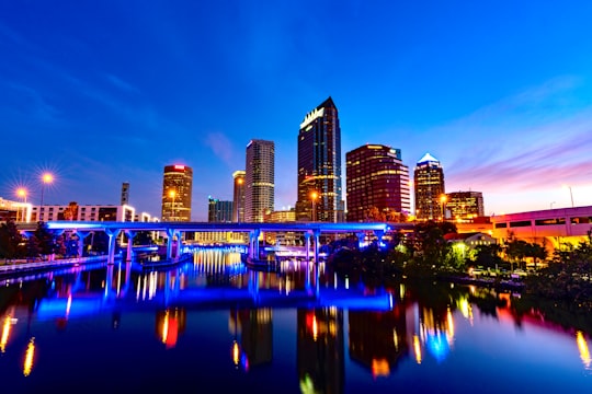 city skyline across body of water during night time in Downtown United States