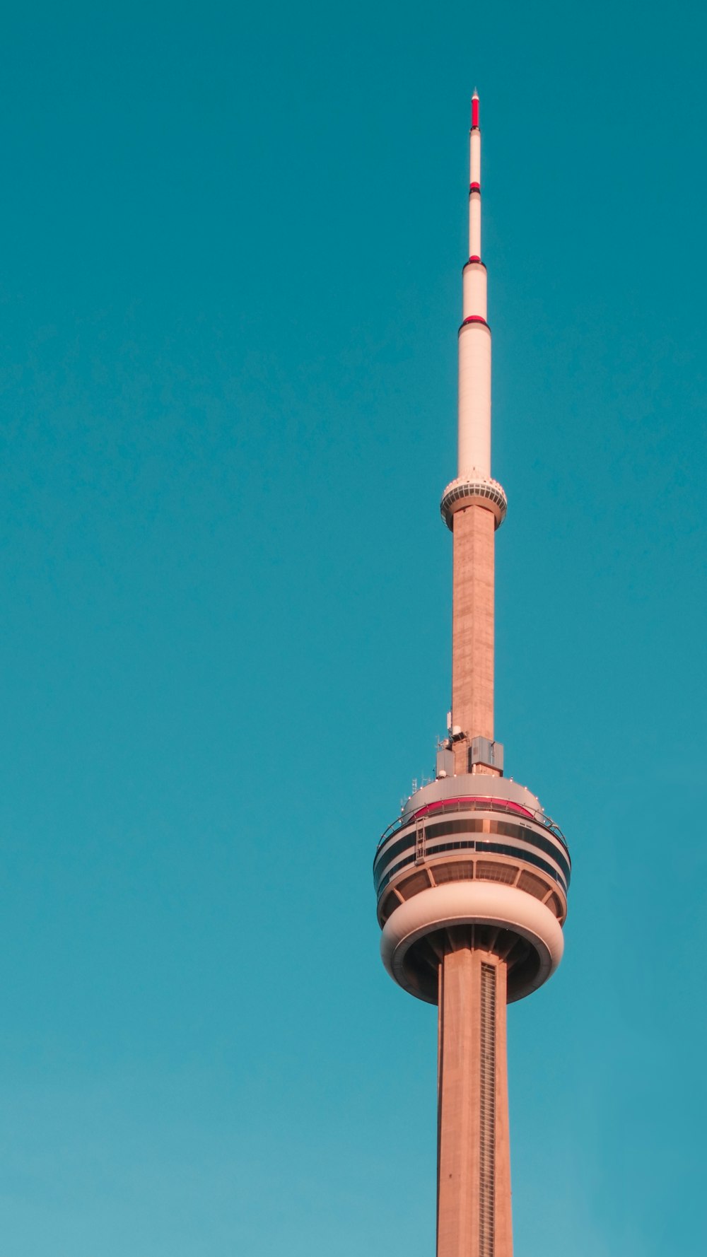 white concrete tower under blue sky during daytime