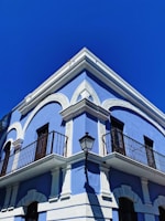 white and black concrete building under blue sky during daytime