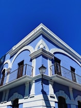 white and black concrete building under blue sky during daytime