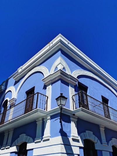 white and black concrete building under blue sky during daytime
