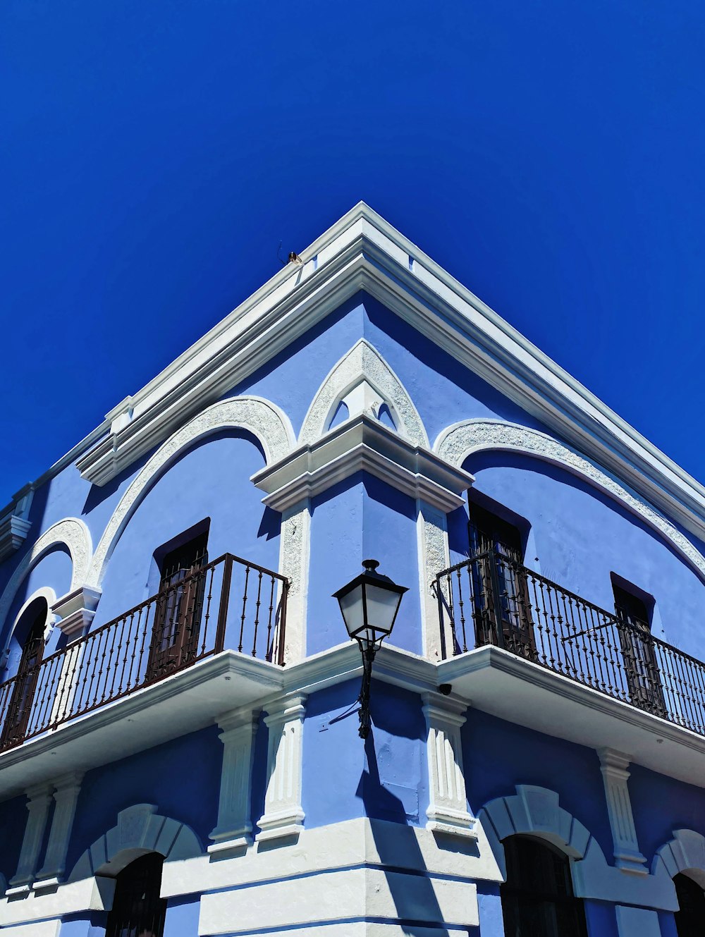 white and black concrete building under blue sky during daytime