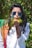 woman in white and red shirt wearing blue sunglasses
