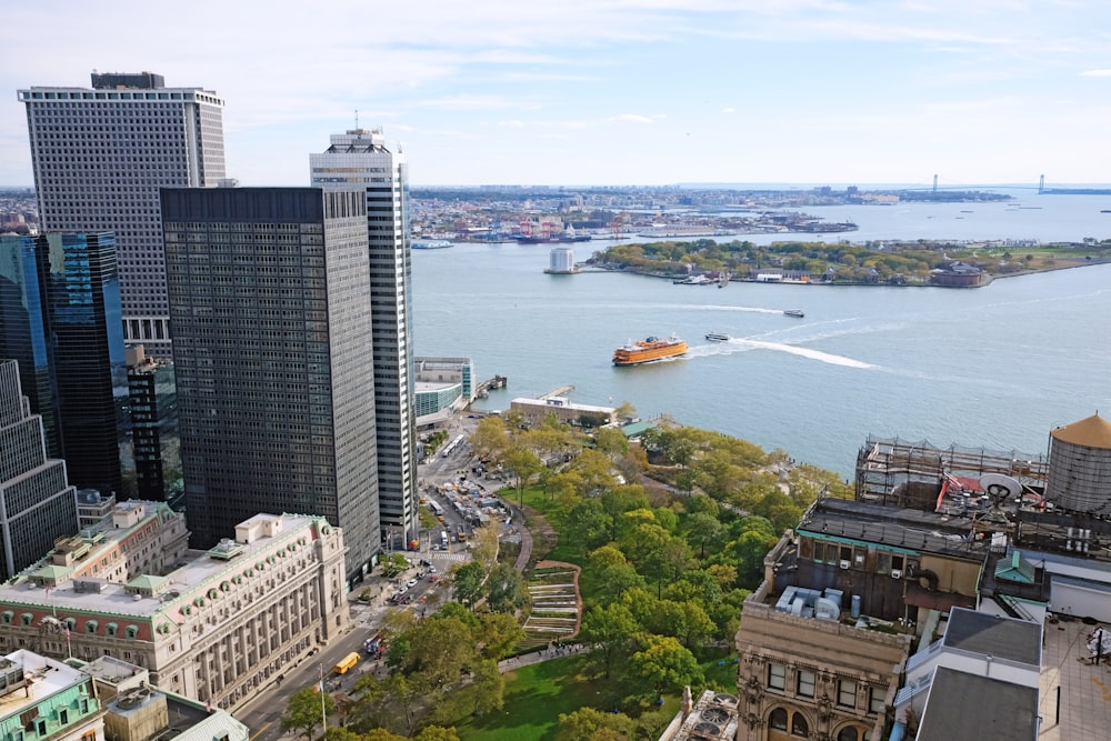 aerial view of city buildings near body of water during daytime