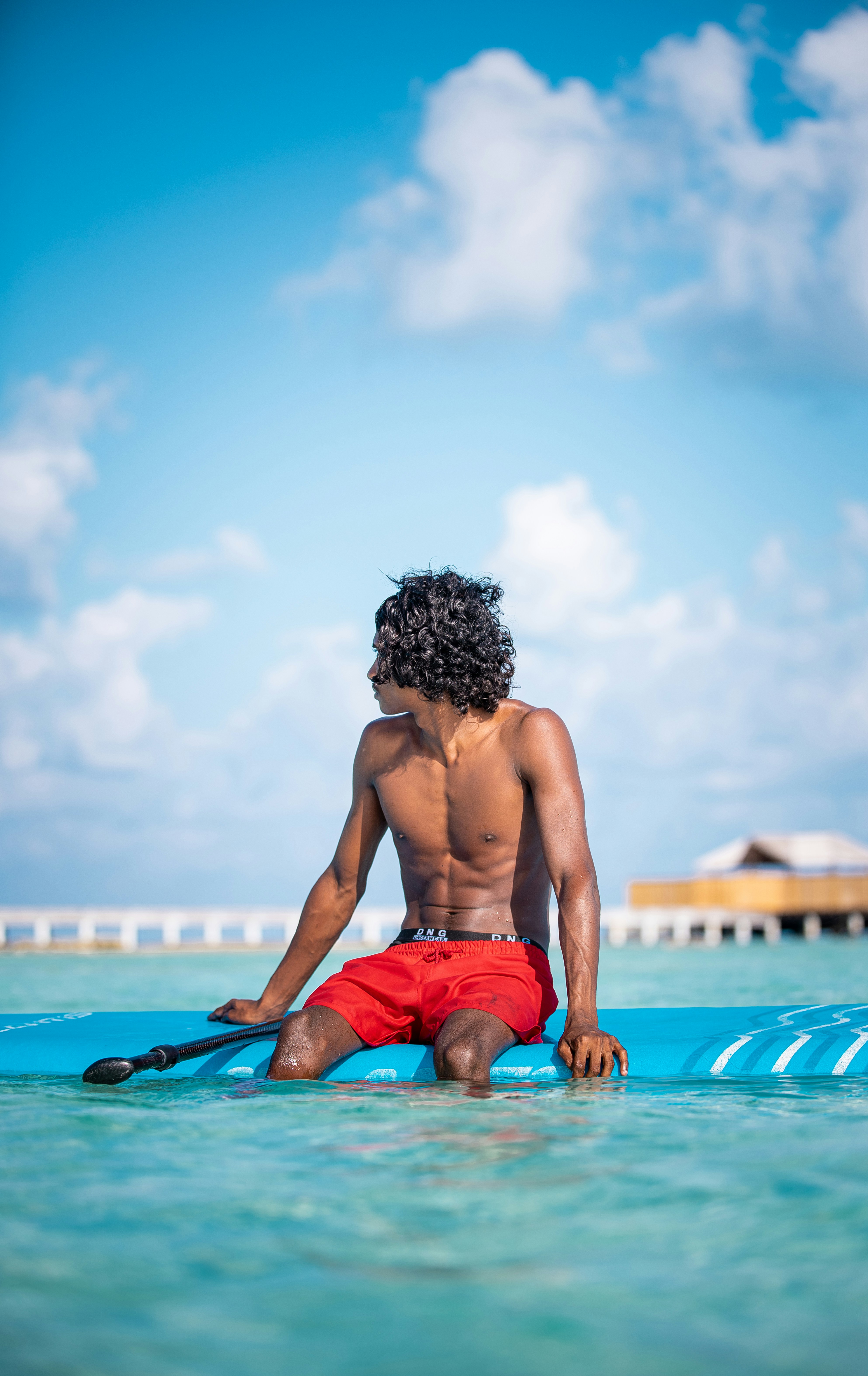 man kissing on woman forehead standing near tree during daytime photo