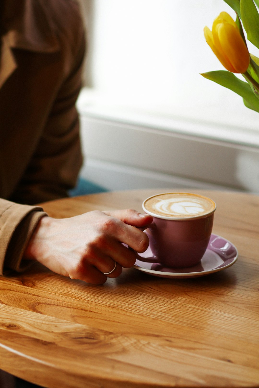 person holding a cup of coffee