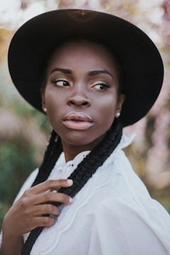 Portrait of a Candomblé priestess in traditional white clothing with serene expression