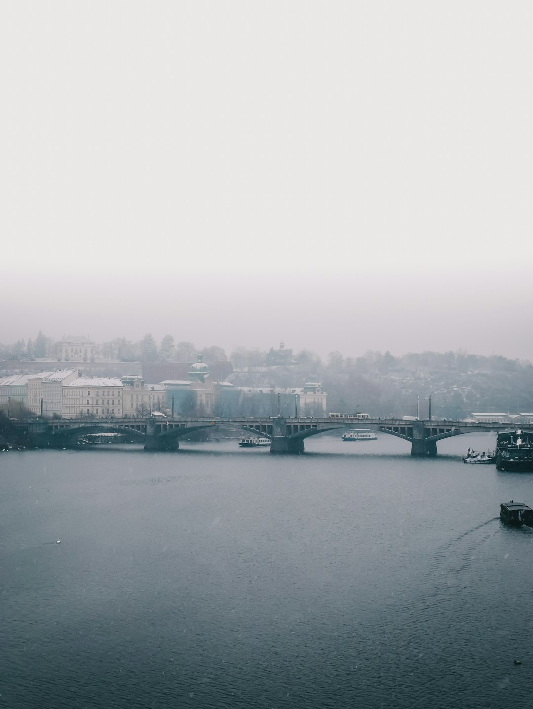 body of water near city buildings during daytime