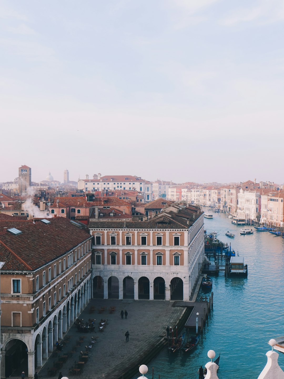 body of water between buildings during daytime