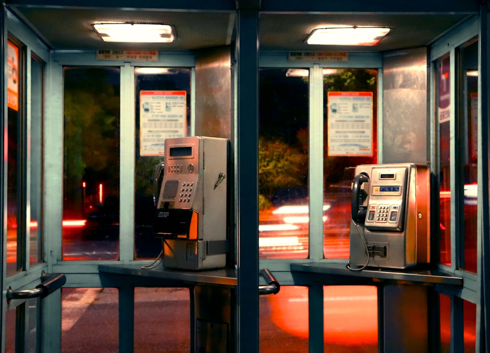 black and silver telephone booth