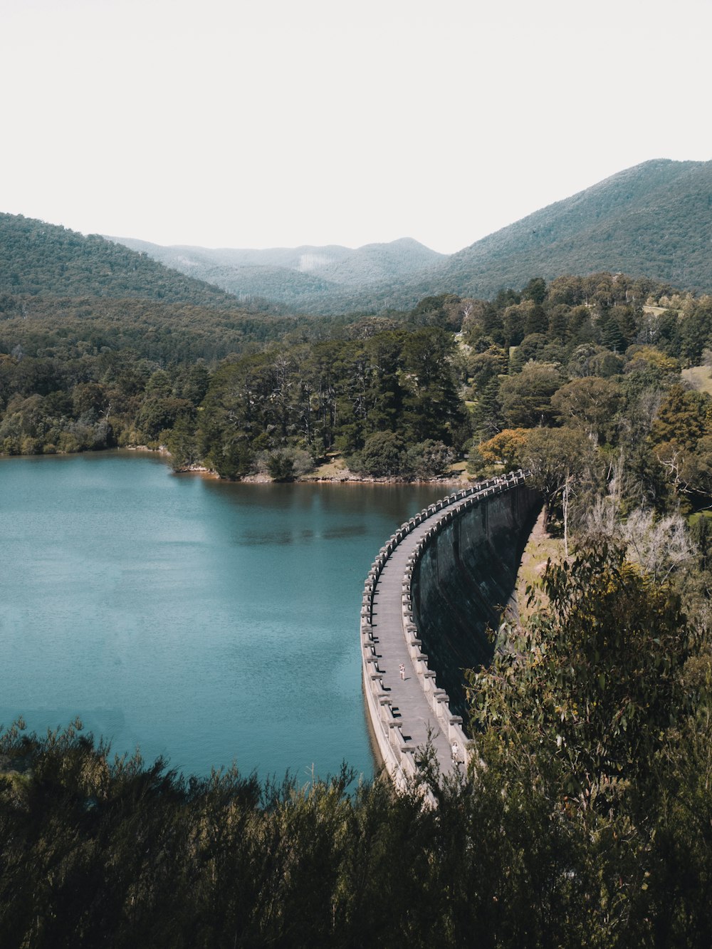 gray concrete bridge over river during daytime