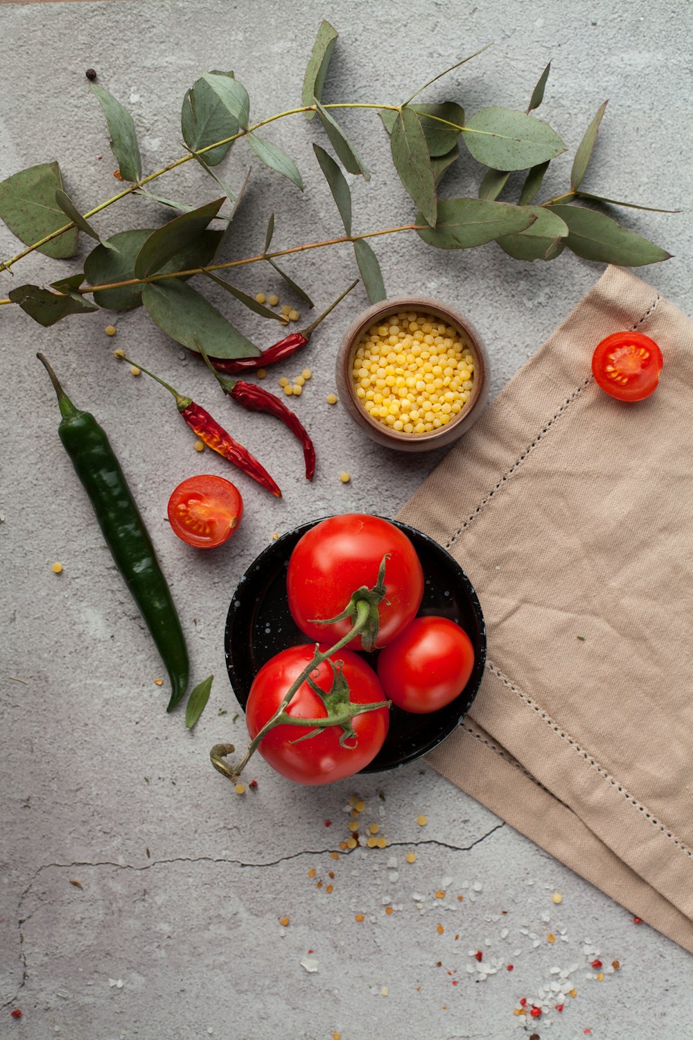 red tomato on brown woven basket