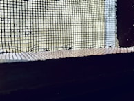 A close-up of a pleated screen mesh showcasing its texture.