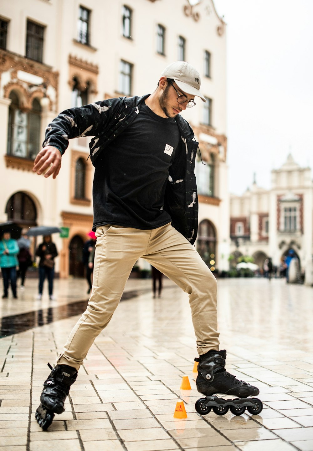 man in black jacket and brown pants wearing brown cowboy hat walking on white floor tiles