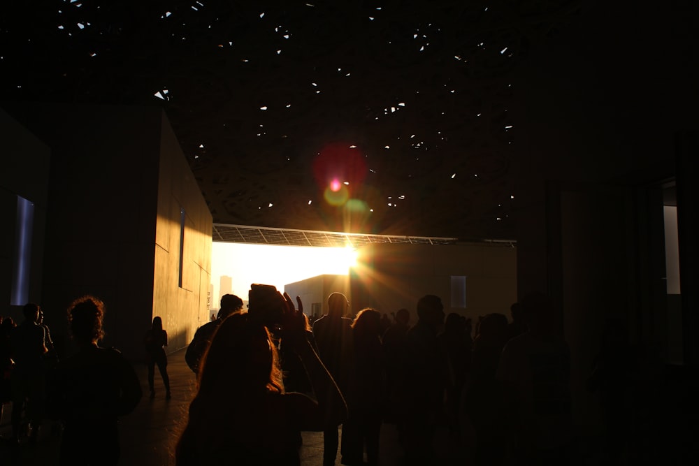 people standing on stage during night time