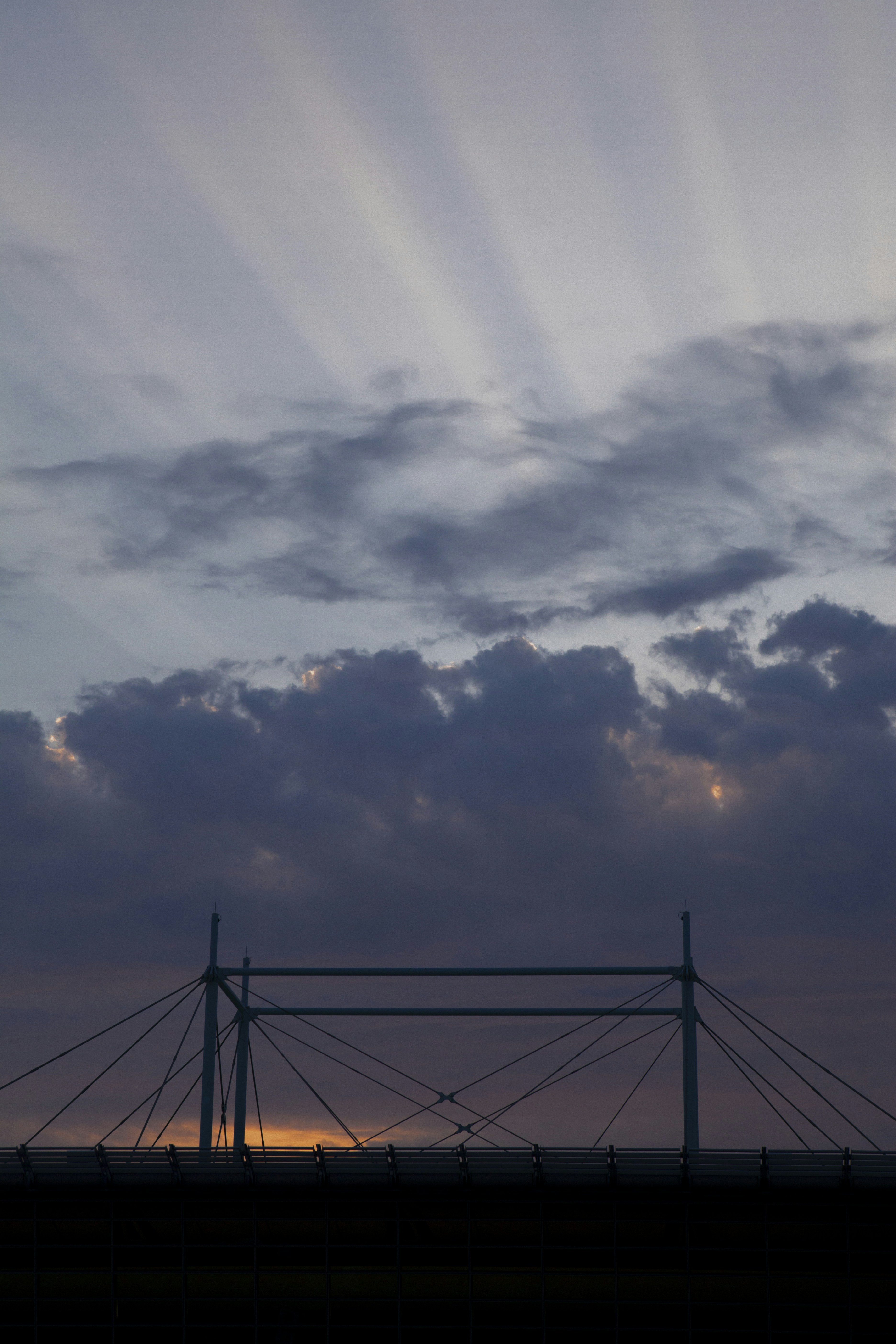 black metal bridge under white clouds